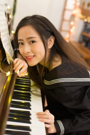 Beautiful piano teacher, young and sweet temperament