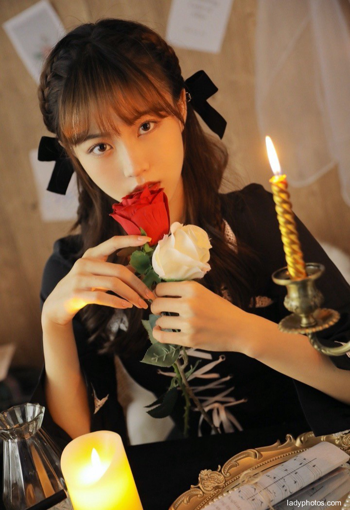 The beautiful and lovely girl in the candlelight is quiet, elegant and charming - 1